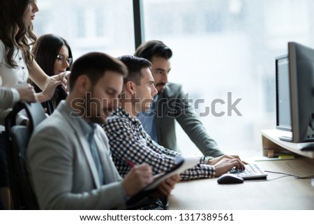 Picture of business people working together in office