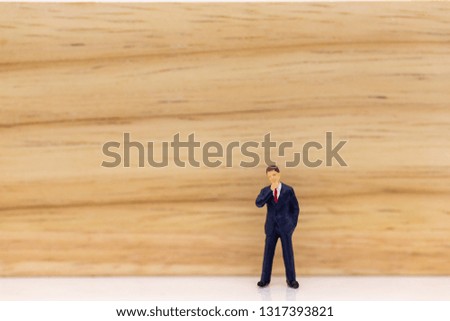 Miniature people: Businessman stand with think space area. Image use for business concept, new idea.