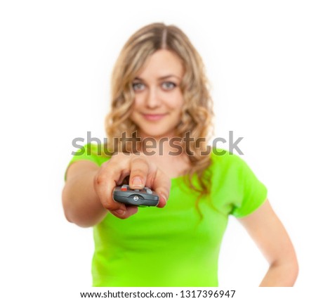 Attractive caucasian woman with TV remote in her hand on white background