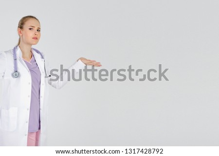 Girl doctor blond young light background studio day beautiful one spread her arms. No understanding knowing failure places to take patient assist.