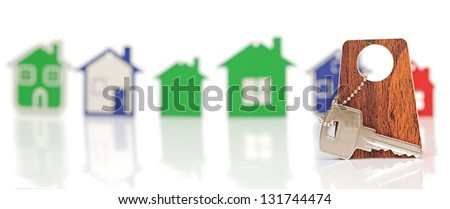 silver key with blank label over the houses background. Space for your text