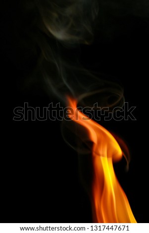Fire and smoke abstract colorful pattern on a black background.