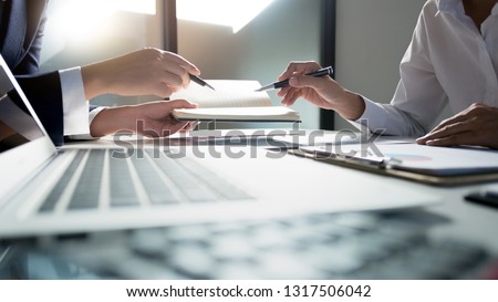 business administrator negotiation discussing  about investment data spreadsheets in modern office. Royalty-Free Stock Photo #1317506042