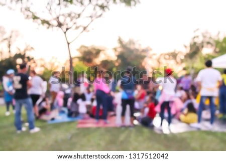 Abstract blur people do activity or picnic in public park with family or friends, urban leisure lifestyle concept, happy holiday recreation vacation in weekend
