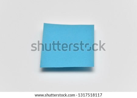 Blue paper floating over white background