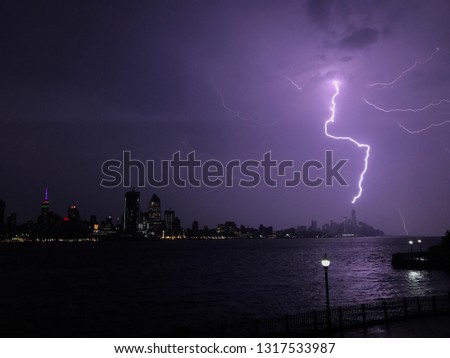 This was taken during a thunderstorm. In this particular photo the strike is hitting the freedom tower.