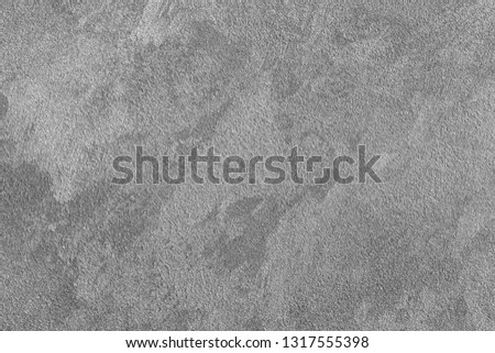 Texture of gray decorative plaster or concrete. Abstract background for design. Monochrome.