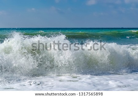 Splashing wave on the Black sea in the day.