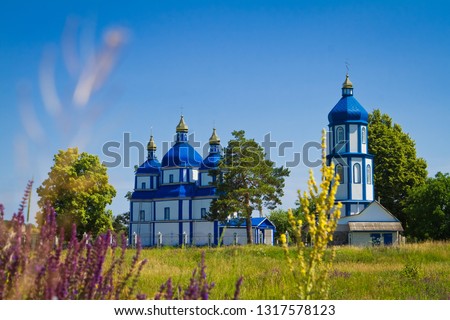 Church of the Nativity of the Virgin, russian orthodox temple, Pechera, Ukraine, new and beautiful temple in a field near Southern Bug rapids, sunny summer morning