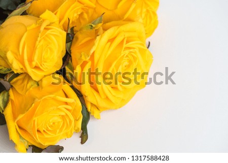 A large bouquet of flowers. Delicate yellow roses on the table. Love theme. Celebration.