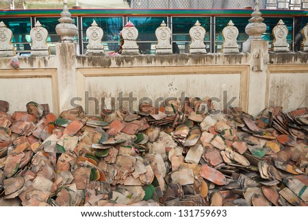 Old temple roof tiles, pile on the floor.