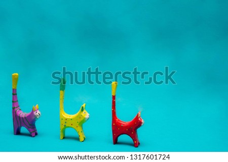 toy cats on a blue background