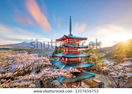 Mountain Fuji and Chureito red pagoda with cherry blossom sakura at sunset Royalty-Free Stock Photo #1317656753