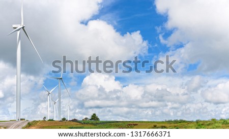 Beautiful nature landscape windmills field on the hill and blue sky, white clouds are the background at Khao Kho, Phetchabun Province, Thailand, 16:9 wide screen