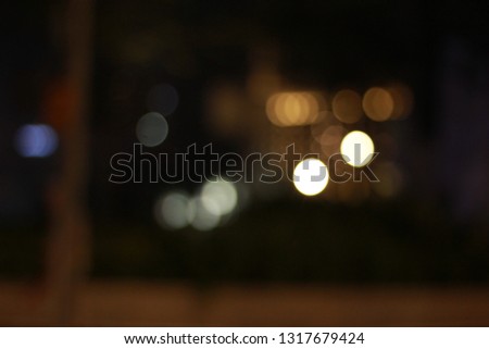 Abstract bubble round blur of street light at night time for background and video layer effect. Royalty-Free Stock Photo #1317679424