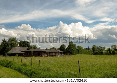 Summer houses in the middle of a field in the countryside