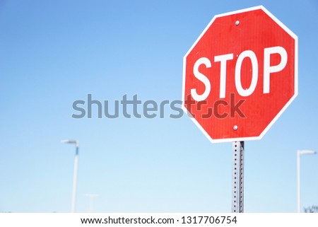 Stop sign with gradient blue sky