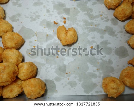 Fried shrimp balls on paper( heart shape)