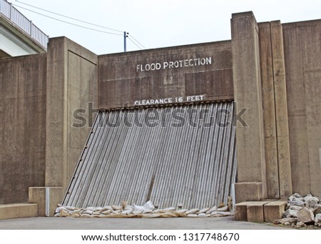 Flood protection barrier on a levee Royalty-Free Stock Photo #1317748670