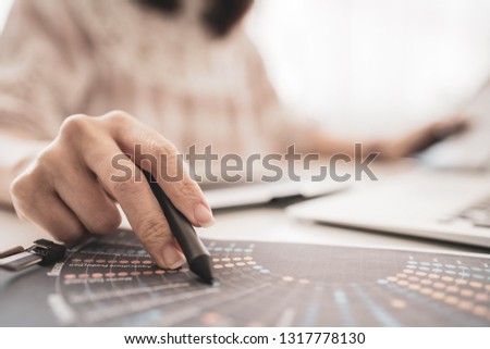 Graphic Designer working with interactive pen display, digital Drawing tablet and Pen on a computer, selected focus