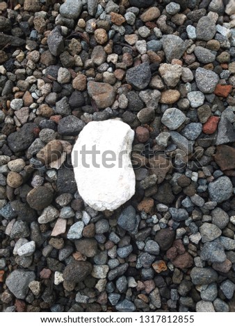 white stone between rocks after the rain