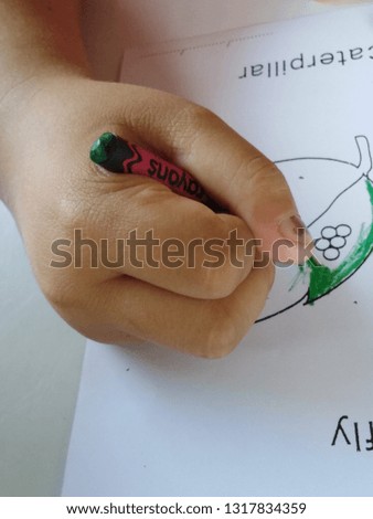 Children are coloring in paper.