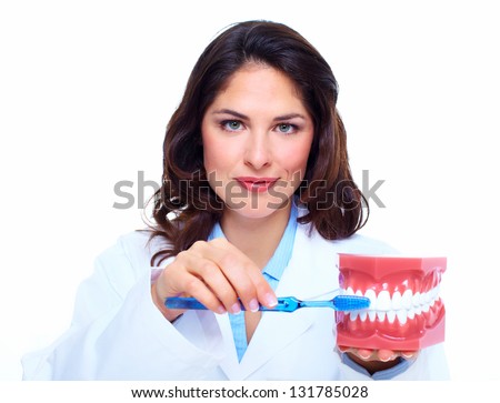 Dentist woman with the teeth model. Dental health care clinic.