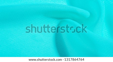 texture background pattern  blue silk fabric. this silk organza has a delicate open weave Use this luxurious fabric for anything from your design for special occasions to the creation of your projects