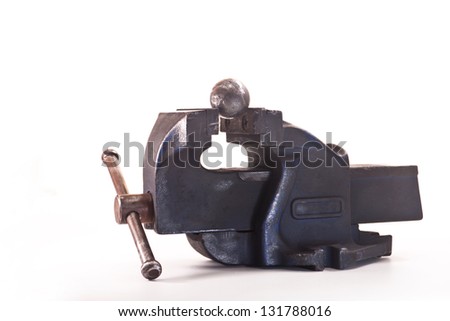 Iron ball clamped in a vise on a white background