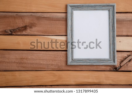Vintage photo frames on wooden background with space for text and various photos