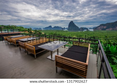 Seat background, chair, cushions, dining table, serving customers sitting and can see the views of the mountains, the sea around and take pictures without asking permission.