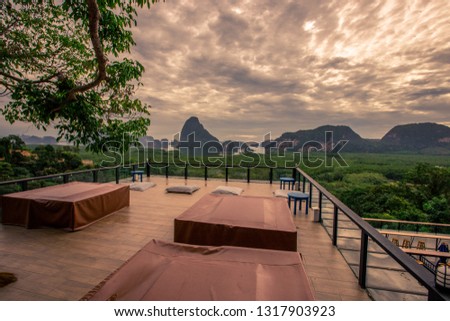 Seat background, chair, cushions, dining table, serving customers sitting and can see the views of the mountains, the sea around and take pictures without asking permission.