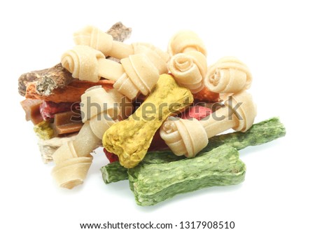 bones and colorful sticks for dog treat with vitamin and oral health on white background