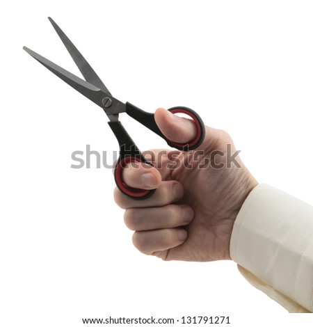 man's hand holding pair of scissors isolated on white