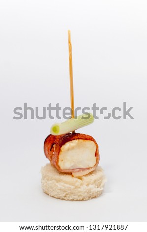 Delicious appetizer of ham and vegetables isolated on white background
