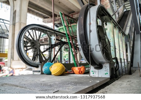 Safety helmet on Escalaror construction building site in metro train station, Maintenance escalator
