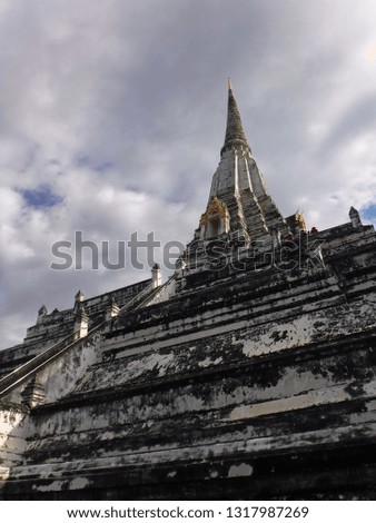 Low angle shot of ancient stupa in Ayutthaya, Thailand