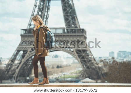 happy girl on the background of the Eiffel Tower in Paris. France
