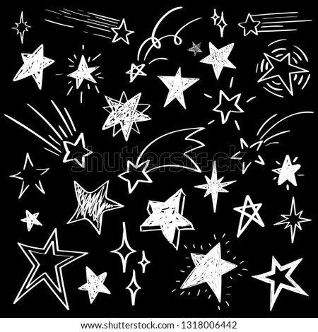 Set of white hand drawn vector stars in doodle style isolated on black background. Could be used as pattern element, cards, childish design