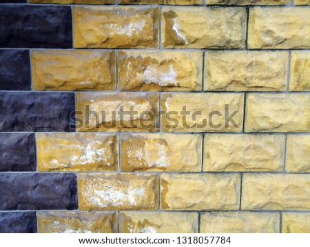 Old painted brick wall. Abstract background. Colorful pattern. 
