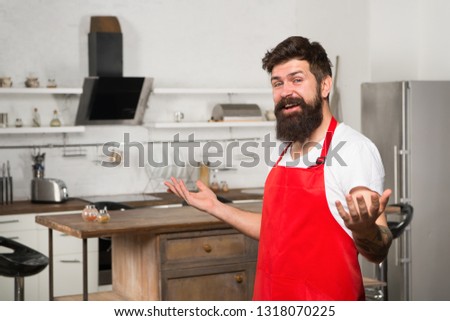 Welcome in the world of tastes. Hipster in kitchen. Restaurant or cafe cook. Bearded man in red apron. Mature male. Bearded man cook. Man chef cooking. Culinary expert. Perfect chef with neat look.