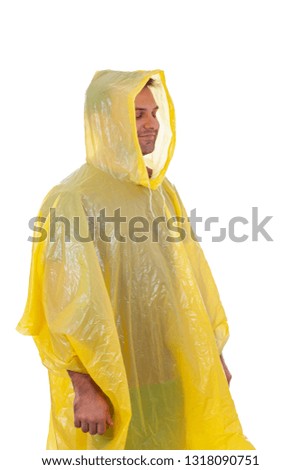 Picture of a caucasian young man wearing a yellow raincoat, posing on isolated background