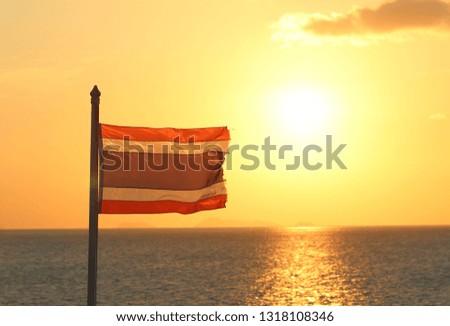 Beautiful Flag of Thailand with sunset background