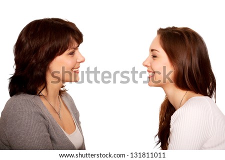 Mother and teenage daughter talking and laughing together. Happy family. A side view. Isolated on white background Royalty-Free Stock Photo #131811011