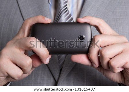 mobile phone camera in male hands