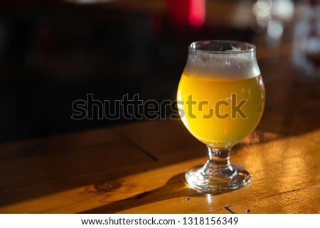 Craft Beer on a Bar with copy space Royalty-Free Stock Photo #1318156349