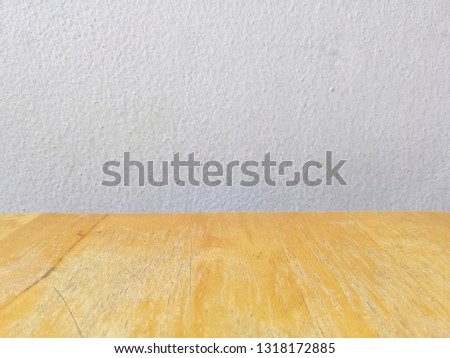 wooden table with white wall​ background, selective focus and blur​ background​