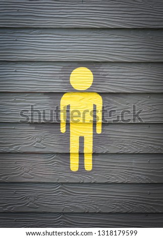 Men Toilet Sign yellow restroom sign on wooden wall door at bathroom 