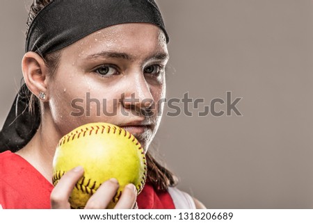 Sweaty girl holding ball