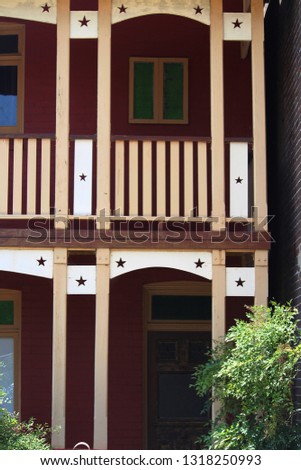 Two storey terrace house featuring timber decorative panels with cut out stars